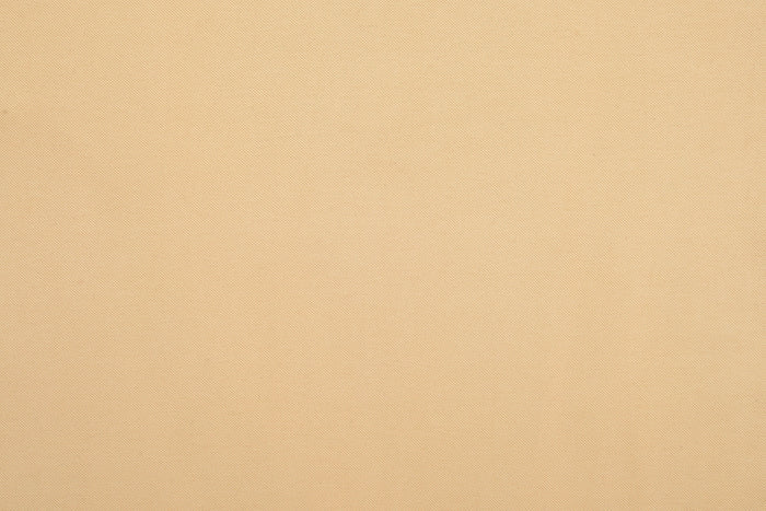 Close up of the custom oxford polo shirt for men by Luxire in light sand
