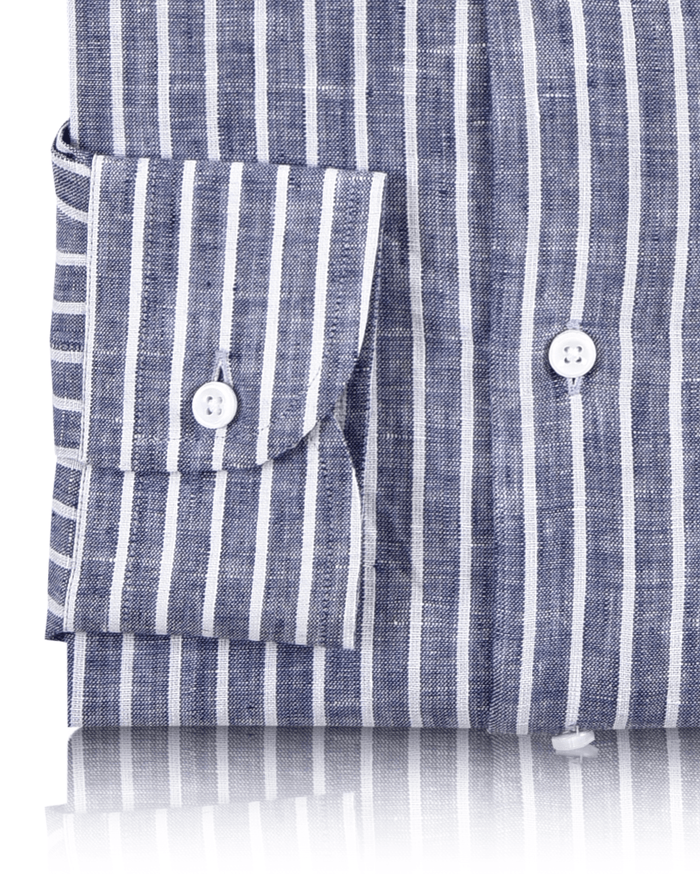 Cuff of custom linen shirt for men in blue chambray with white stripes