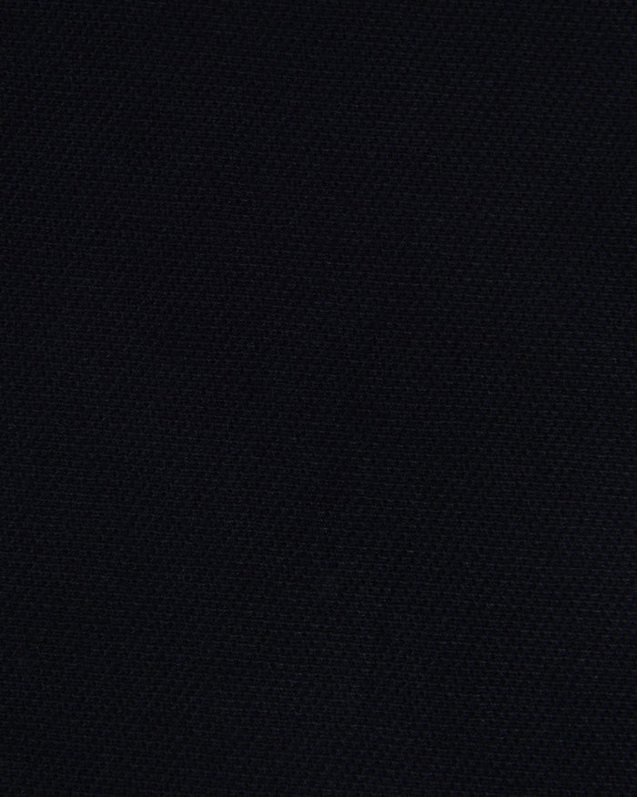 Close up of the custom oxford polo shirt for men by Luxire in midnight navy