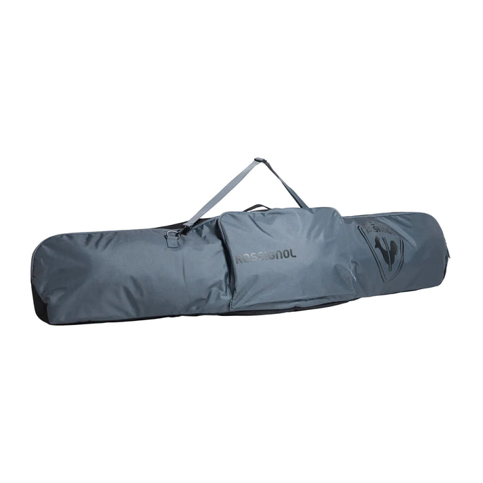 Gray snowboard bag with a visible brand logo on a light gray background
