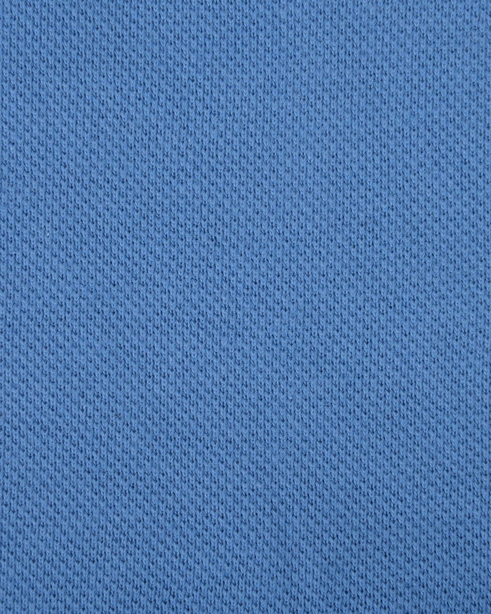 Close up of the custom oxford polo shirt for men by Luxire in steel blue 2