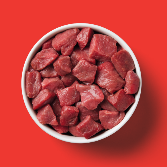 The Ultimate Cat Dad Box features premium raw cat food in a white bowl—purrfect for Father’s Day!.